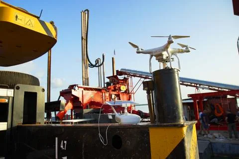 A drone with a platform for the extraction of gold. About gold, gold mining. Stock Photos