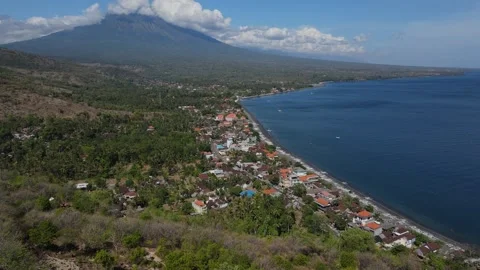 Drone point view to Amed beach and volcano Agung at background at sunny day Stock Footage 257653834