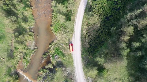 Drone point of view of car with canoe on the rooftop Stock Footage 276387688