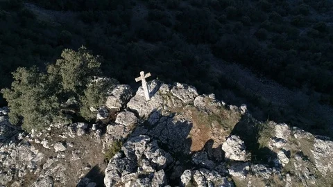 Drone point of view of a holy cross standing in a mountain peak, Spain Stock Footage 126351859