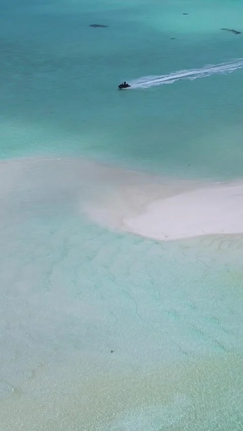 Drone point view at jet ski in the sea near sandbank.Vertical video Stock Footage 305913666
