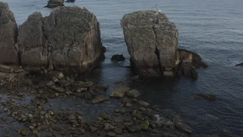 Drone point of view of a low tide reef with a fisherman and seagulls in Spain 4K Stock Footage 137708279