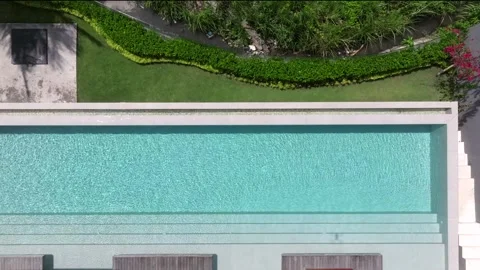 Drone point of view of modern porch of a house with swimming pool. Modern Infini Stock Footage 290003299