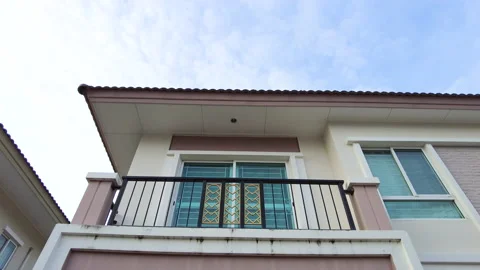 Drone point of view moving motion from the ground through the house gate Stock Footage 158317988