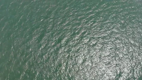 Drone Point of View on Rippled Sea Water Surface Reflecting Sunlight Stock Footage 159643627