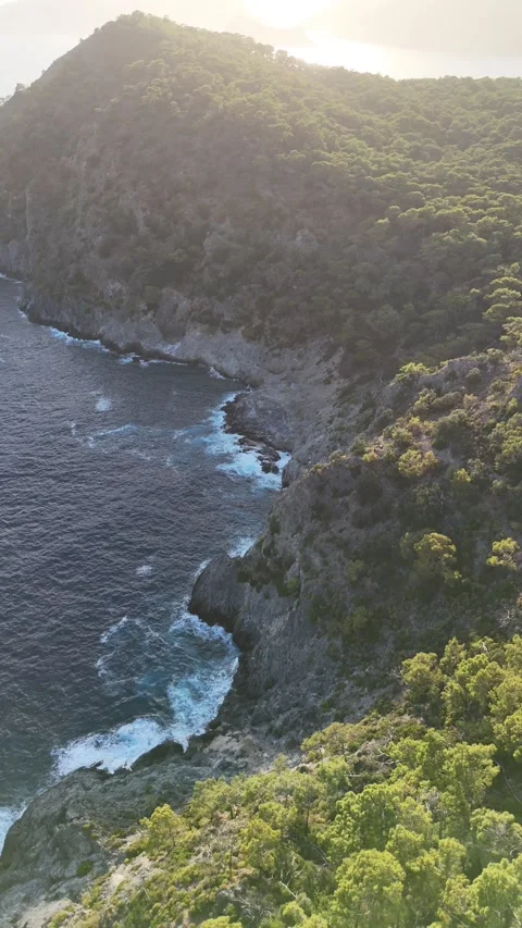 Drone point of view of sea and mountains by the coast Stock Footage 336391938