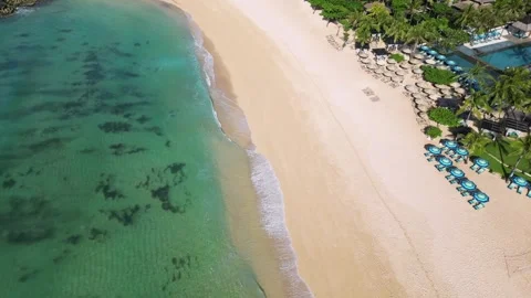 Drone point of view at seascape with white sand beach and poolside Stock Footage 311944381