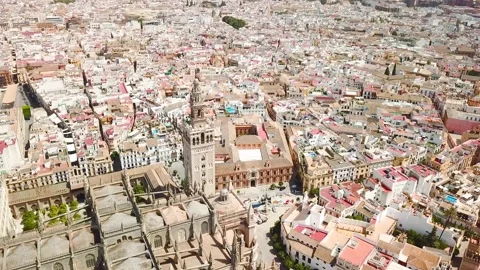 Drone point of view of Seville Cathedral, and city center Stock Footage 150970213