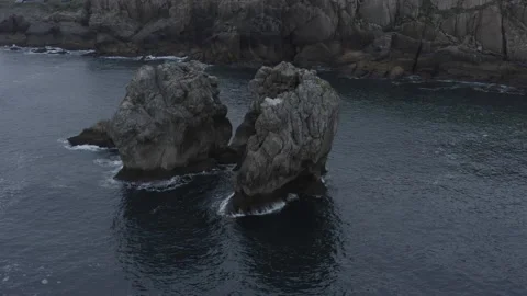 Drone point of view shot of Cliffs in the middle of the ocean in Spain Stock Footage 137707977
