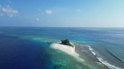 Drone point of view at small island in the sea Video stock 309769042