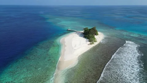 Drone point of view at small island in the sea Video stock 309771534