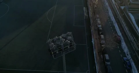 Drone Point of View of Soccer Stadium Lights during sunrise 4K  Stock Footage 155000360