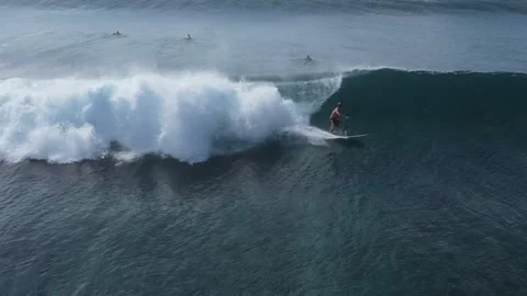 Drone point of view of surfer in the ocean Stock Footage 250985415