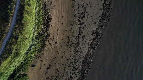 Drone points directly down on mudflats of River Thames Stock-Footage 92511110