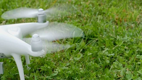 Drone propeller turns on preparing for flight outdoors Video stock 94170315