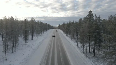 Drone Pull Away Of Car Driving On Arctic Forest Road In Finnish Lappland Stock Footage 221343500
