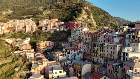 Drone Pull-Away from Colorful Italian Mountain Town with Waterfront Vídeo Stock 339221512