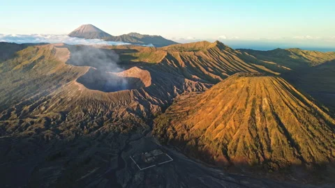 Drone Pull-Away from Mount Bromo in Golden morning Light, Indonesia Stock Footage 343734171