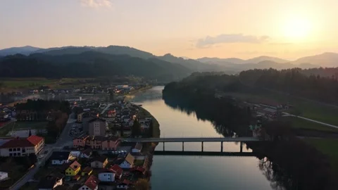 Drone pull away from river bridge at sunset Stock Footage 330544463