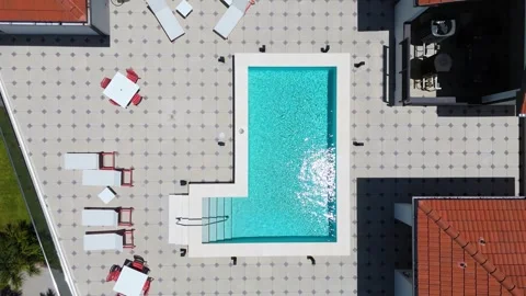Drone Pull Away From Rooftop Pool With Lounge Chairs In Venice Florida Stock Footage 339297758