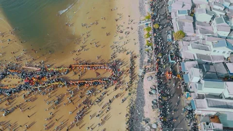Drone Pull-away Shot of Coastal Festival and Embankment in Phuoc Hai Stock Footage 334329840