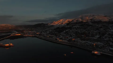 Drone pull back along Fort William waterfront on Loch Linnhe at dusk Stock Footage 330591856