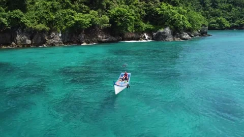 Drone Pull Back and Ascend from Fishing Boat, Pulau Nasi, Indonesia Stock Footage 315300492
