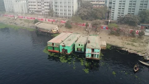 Drone Pull Back and Rise Showing Ships Used as Hotels on Buriganga River Stock Footage 327352505