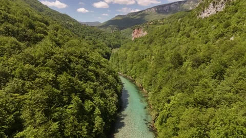 Drone Pull Back and Rise over Tara River Canyon to Reveal Arch Bridge, 4K Stock Footage 337180312