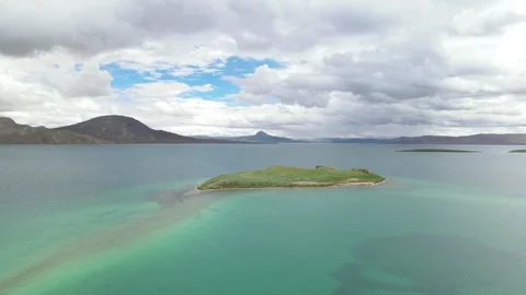Drone Pull Back from Bird Island in Tso Ngön (Blue Lake), Tibetan Plateau Stock Footage 326212689