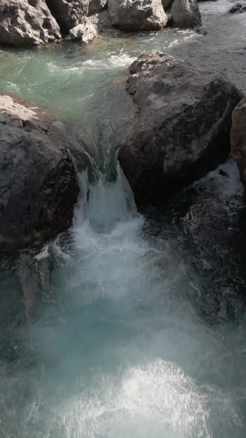 Drone pull back clip over mountain stream Video stock 330440504