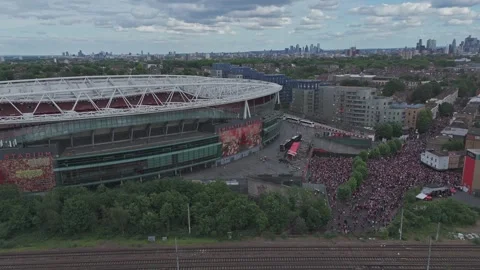 Drone pull back from the Emirates Stadium and massive crowd [4K] Stock Footage 336391982