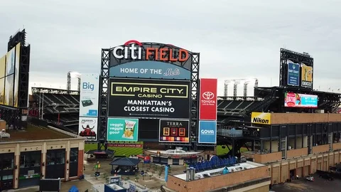 Drone pull back from exterior rear of Citi Field Stock Footage 106513448