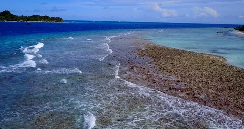 Drone pull back footage of an exotic beach with many an interesting Stock Footage 118217501