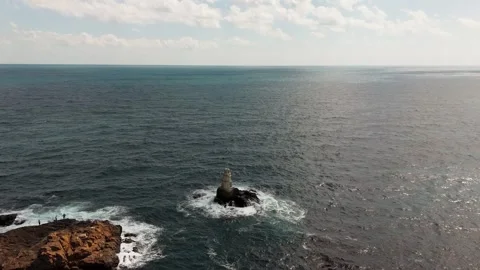 Drone Pull Back Over Ahtopol Lighthouse and Waves Stock Footage 316723755