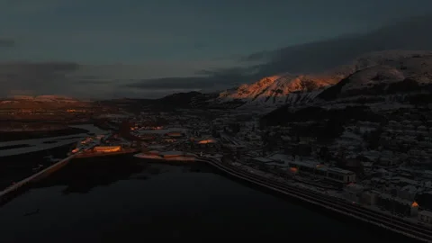 Drone pull back over Fort William pier and waterfront at winter sunset Stock Footage 330591717