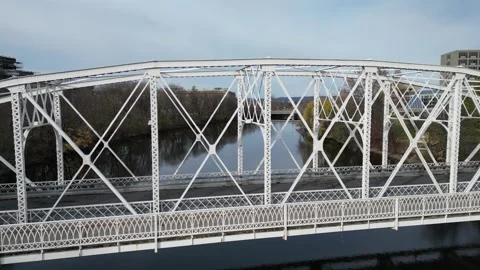 Drone pull back over a river of an old bridge Stock Footage 292534772