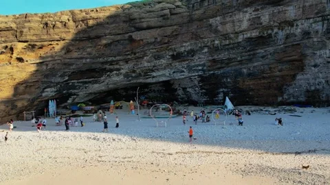 Drone pull back reveal of Hang Cau volcanic cliff and beach 4K Vídeos de archivo 336039535