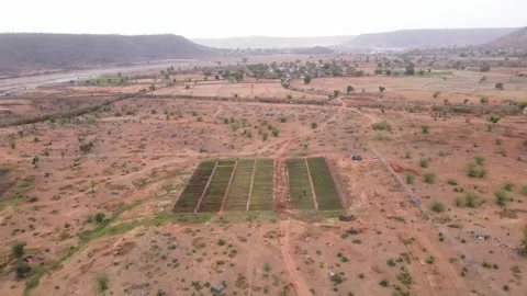Drone Pull Back Reveal of Rural Tree Nursery and Agricultural Landscape in I Stock Footage 338065307