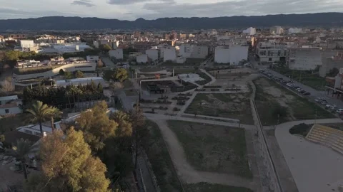 Drone Pull Back Revealing Alcantarilla Library Park and Roman Water Wheel Stock Footage 335891173