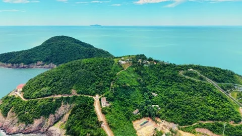 Drone pull back revealing hiking trails climbing Song Ngu Island 4K Stock Footage 340303948