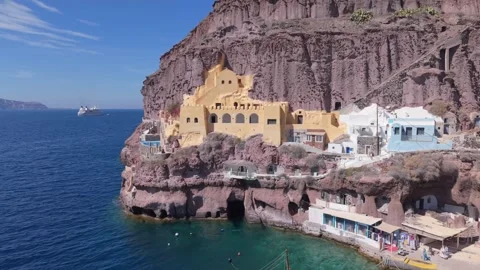 Drone Pull Back Revealing Old Port Fortress Landscape in Santorini. Stock Footage 334834670