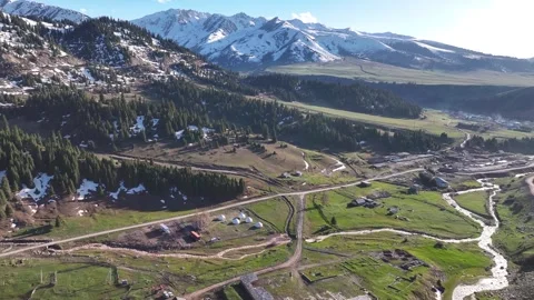 Drone pull back from traditional yurt camp in Jyrgalan, Kyrgyzstan. Travel Stock Footage 336527607