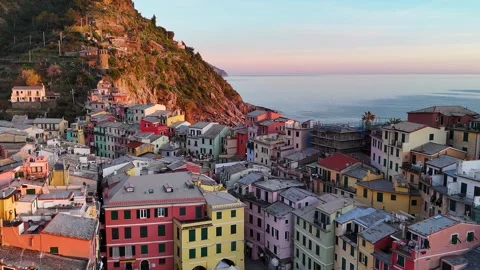 Drone Pull-Out of Colorful Italian Town by the Water at Sunset Vídeo Stock 339221561