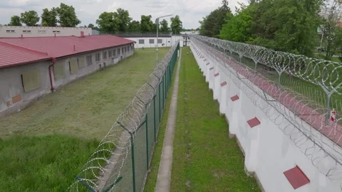Drone Pull-Out from Prison Fence and Wall Vidéo 320149663