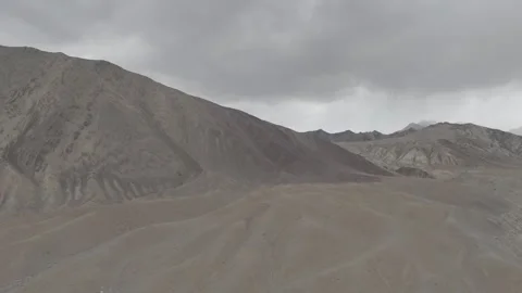 Drone Pull Out Revealing Massive Ladakh Mountain with Layered Rocky Valley with Stock-Footage 335746294