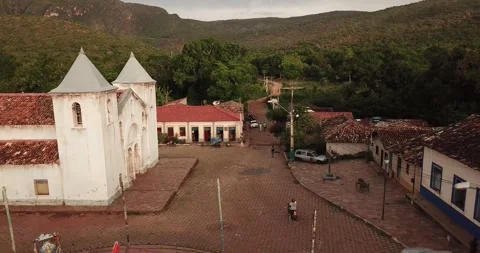 Drone pull-out shot from Natividade city to surrounding Cerrado biome Stock Footage 317732597