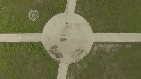 Drone pull vertical circle path with cross Stock Footage 160882621