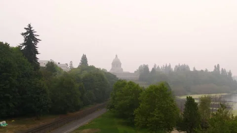 Drone pull of Wahington state capitol building and surrounding buildings, lake Stock Footage 139246905