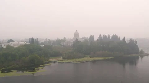 Drone pull of Wahington state capitol building and surrounding buildings, lake Stock Footage 139247076